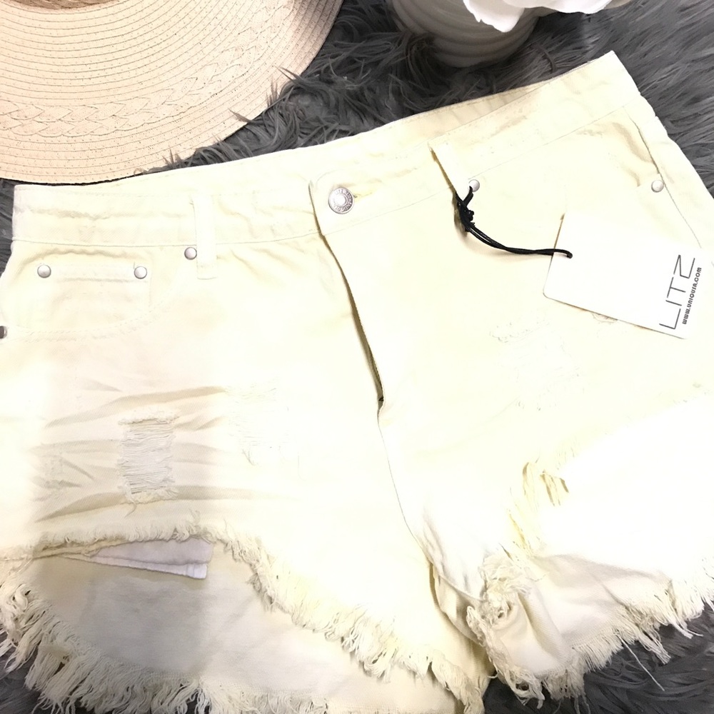 Frayed distressed denim shorts